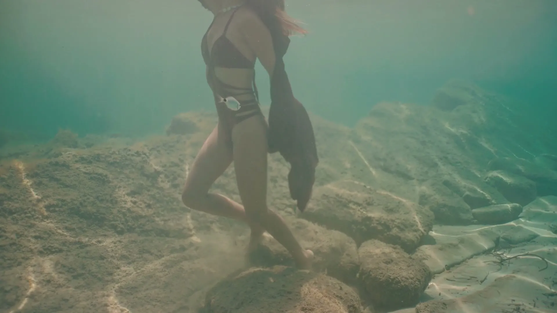 Marina San Martín moving underwater in a Tulum cenote