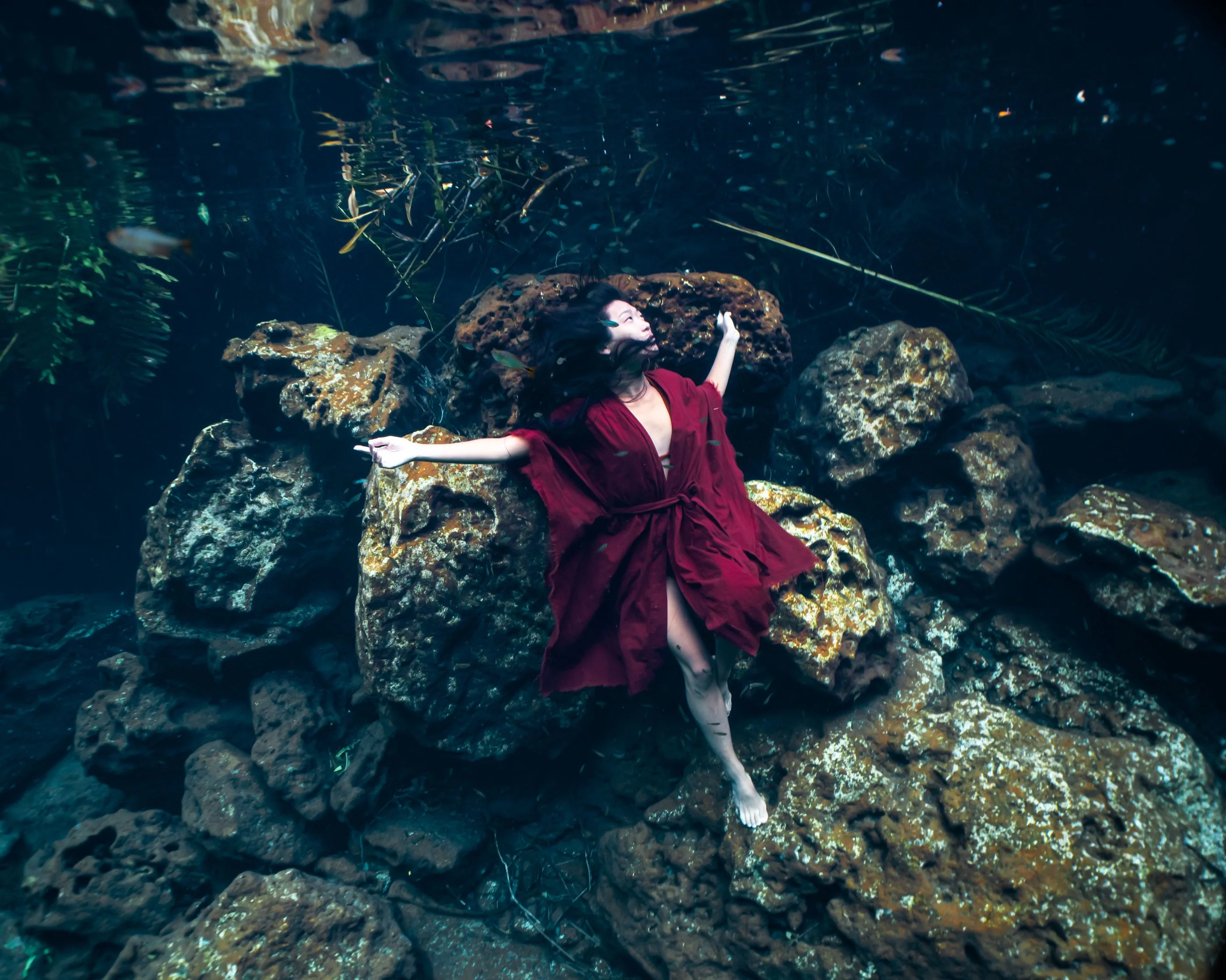 Woman in a flowing dress beneath the surface